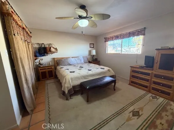 a front view of a house with a large window