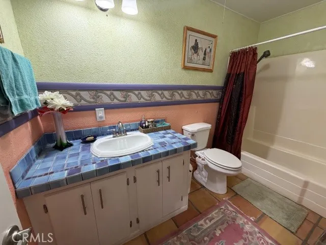 a room with furniture and a flat screen tv