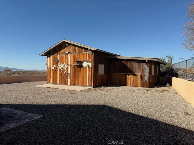 a front view of a house with a large window