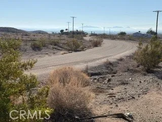a view of a balcony with wooden floor
