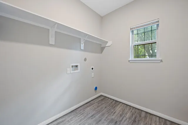 a view of room with window and closet
