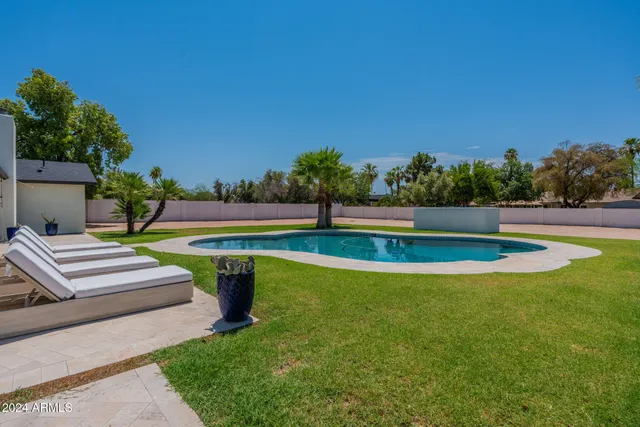a view of a swimming pool with a patio