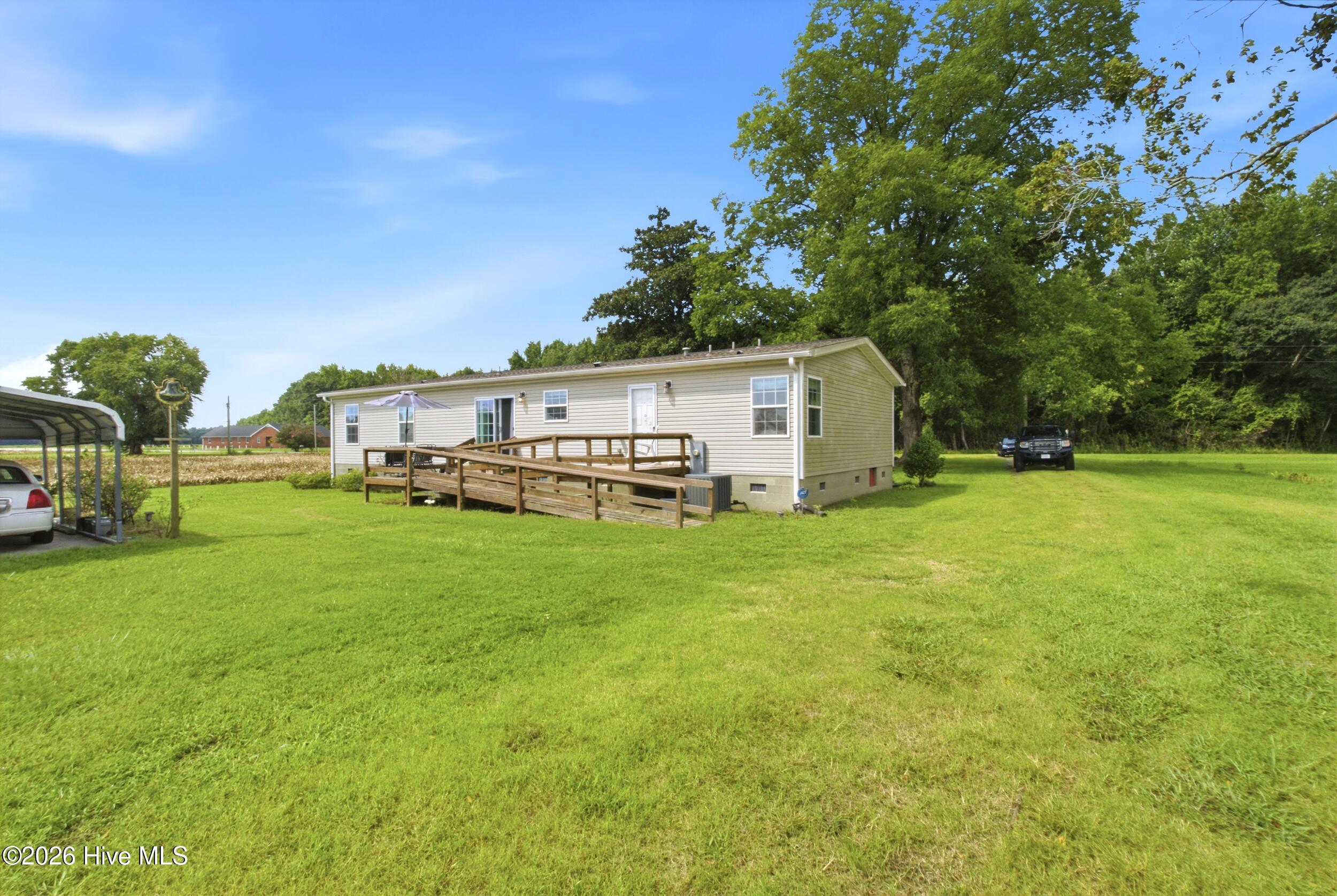 1230 Beech Springs Road Tyner, NC 27980 - Photo 21 of 32 Rear of home with ramp and deck