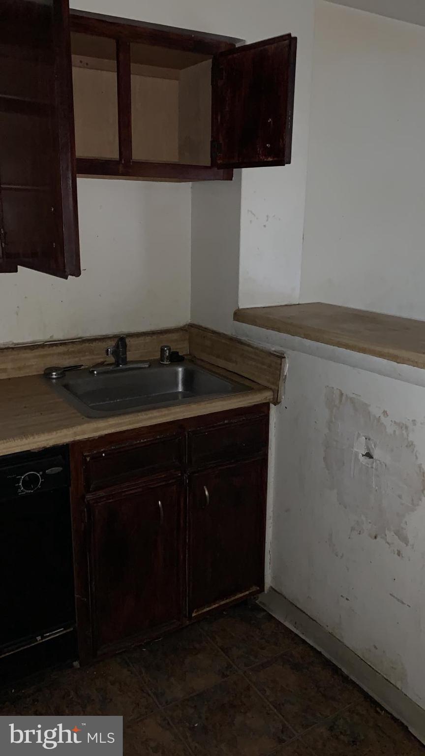 2634 Bowen Road Southeast, Unit 202 Washington, DC 20020 - Photo 3 of 11 a kitchen with a sink and cabinets
