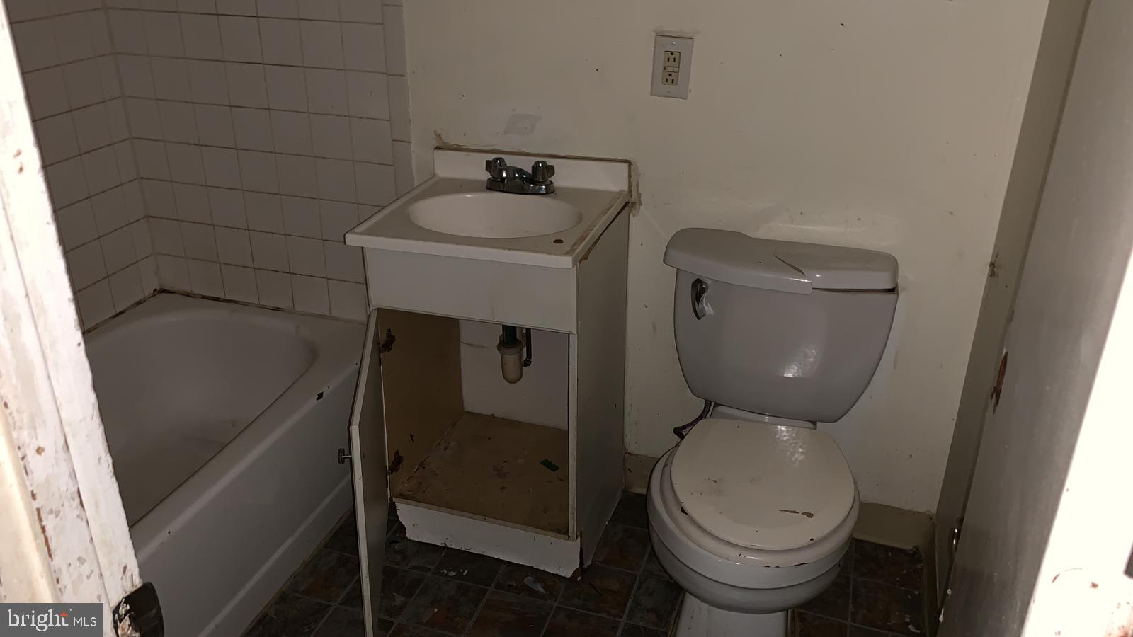 2634 Bowen Road Southeast, Unit 202 Washington, DC 20020 - Photo 7 of 11 a bathroom with a toilet and a sink