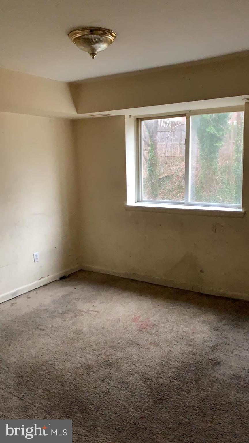 2634 Bowen Road Southeast, Unit 202 Washington, DC 20020 - Photo 8 of 11 an empty room with a window