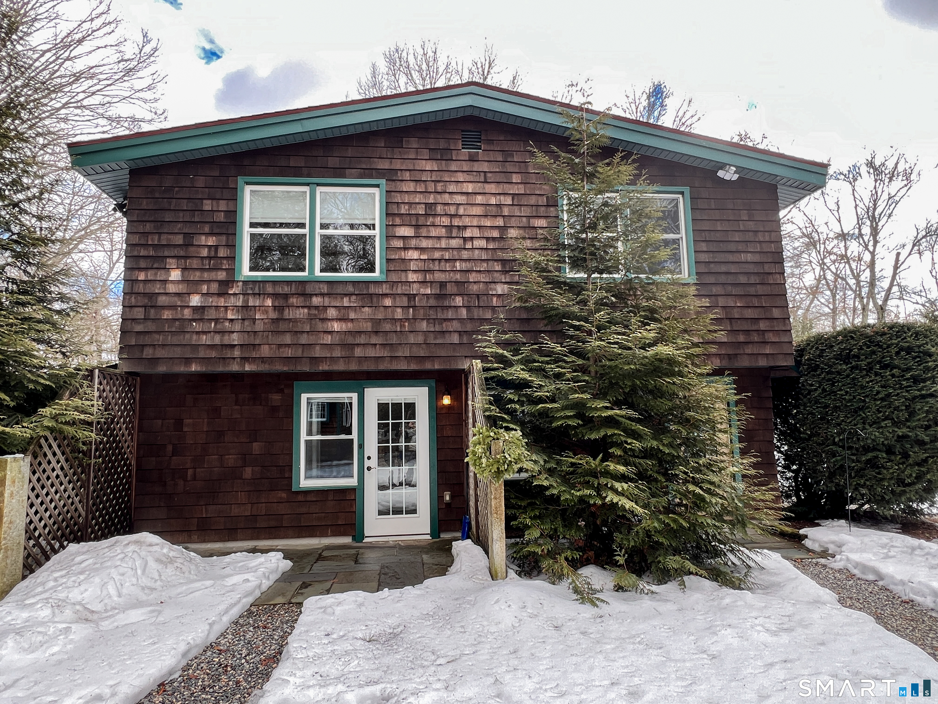 a front view of a house with garden