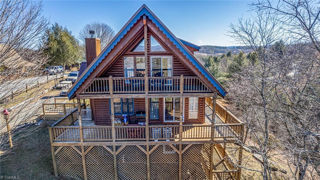 83 Mountain Ridge Road Piney Creek, NC 28663 - Photo 1 of 39 Incredible wall of windows brings the outdoors in