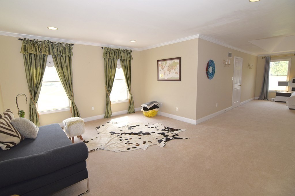 43 Cherokee Road Canton, MA 02021 - Photo 13 of 22 a living room with a couch and a table