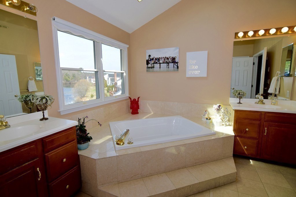 43 Cherokee Road Canton, MA 02021 - Photo 15 of 22 a bathroom with a tub sink and mirror