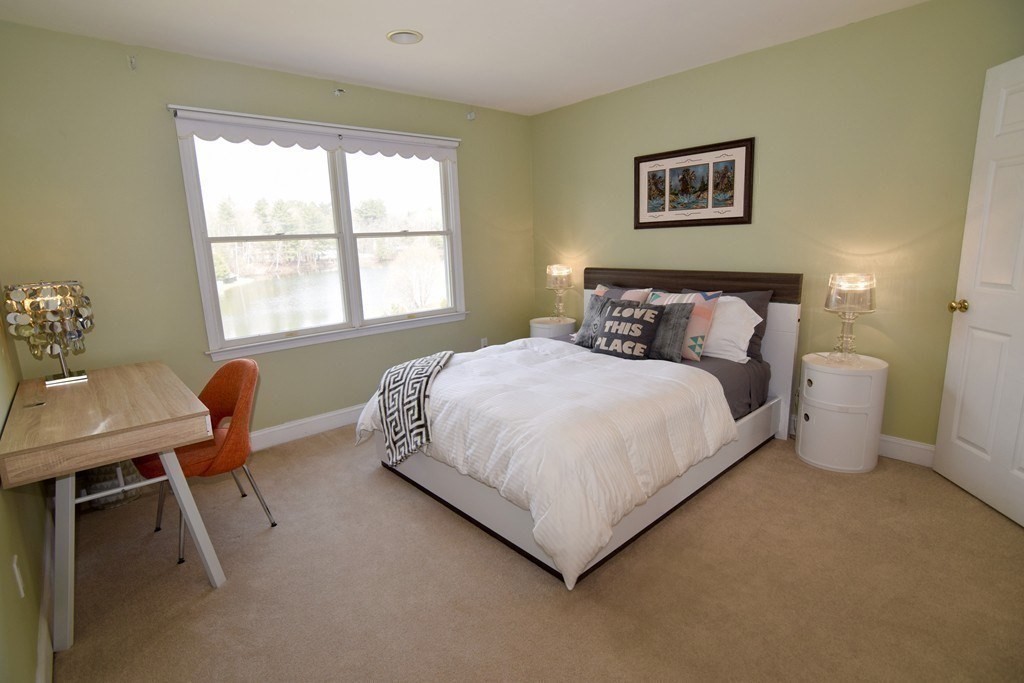 43 Cherokee Road Canton, MA 02021 - Photo 16 of 22 a bedroom with a bed and a window