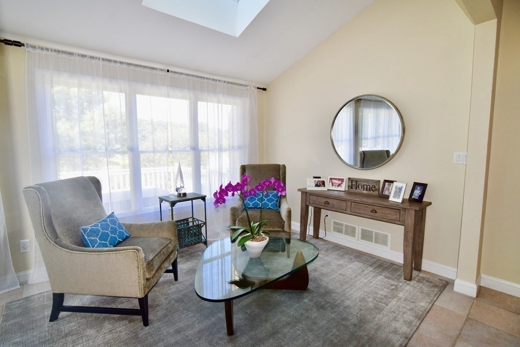 43 Cherokee Road Canton, MA 02021 - Photo 3 of 22 a living room with furniture a potted plant and a large window