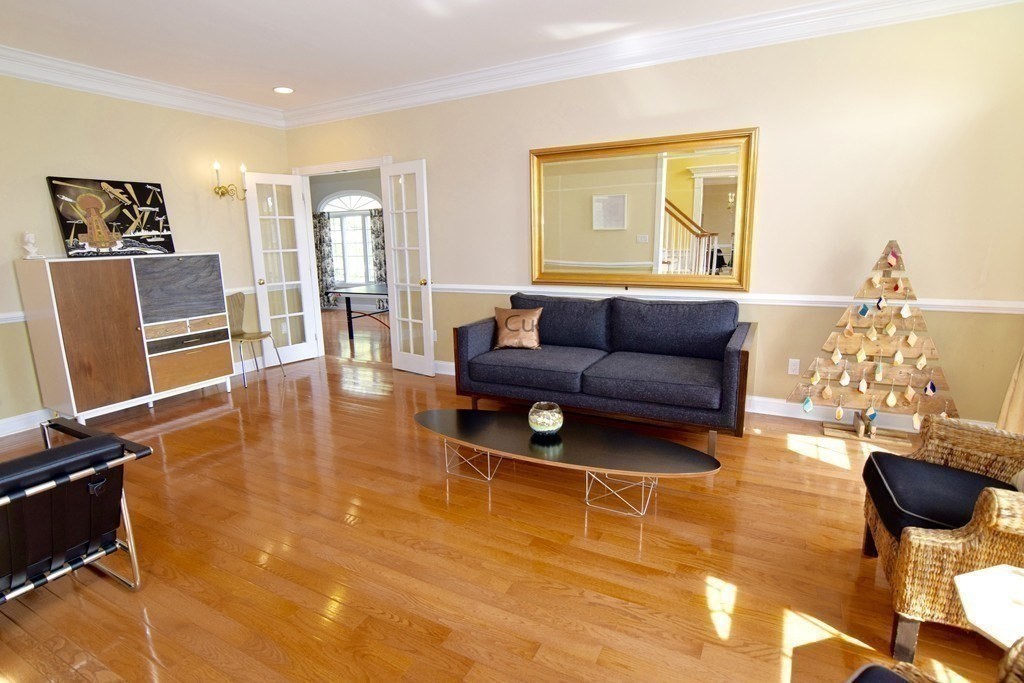 43 Cherokee Road Canton, MA 02021 - Photo 4 of 22 a living room with furniture and a flat screen tv