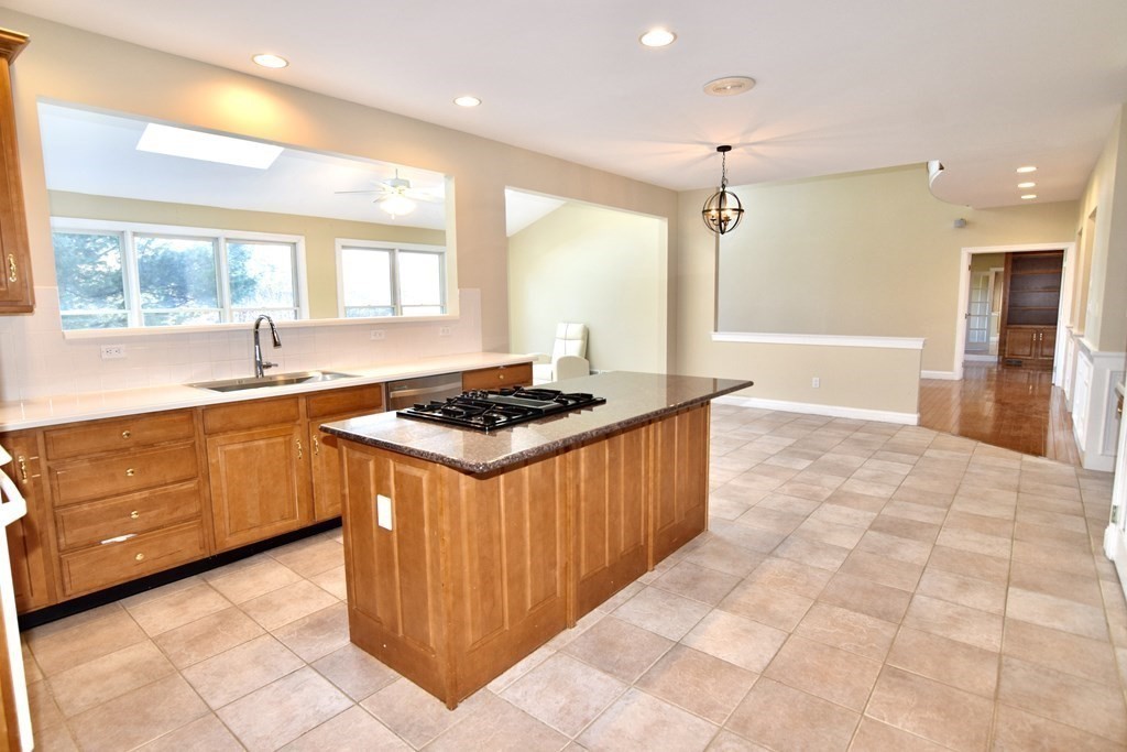 43 Cherokee Road Canton, MA 02021 - Photo 8 of 22 a kitchen with stainless steel appliances granite countertop a stove a sink and a refrigerator