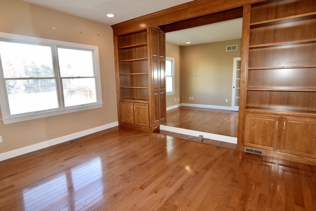 43 Cherokee Road Canton, MA 02021 - Photo 10 of 22 an empty room with wooden floor and windows