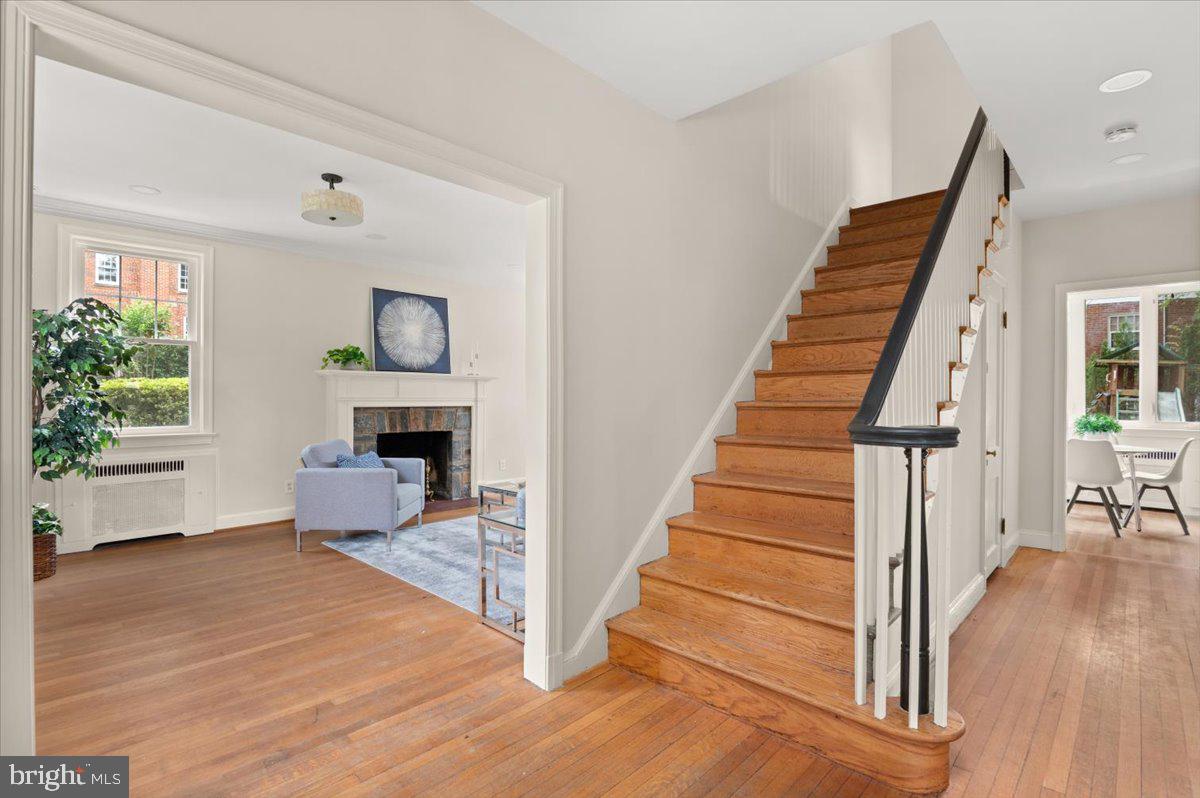9214 Crosby Road Silver Spring, MD 20910 - Photo 11 of 65 a view of a livingroom with wooden floor and staircase