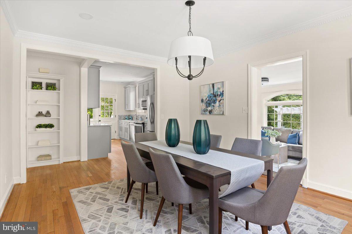 9214 Crosby Road Silver Spring, MD 20910 - Photo 16 of 65 a view of a dining room with furniture window and wooden floor