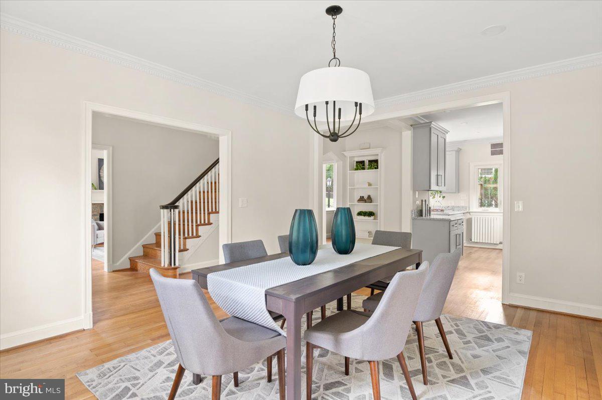 9214 Crosby Road Silver Spring, MD 20910 - Photo 17 of 65 a view of a dining room with furniture wooden floor and chandelier