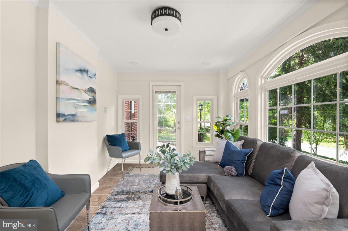 9214 Crosby Road Silver Spring, MD 20910 - Photo 20 of 65 a living room with furniture potted plant and a large window