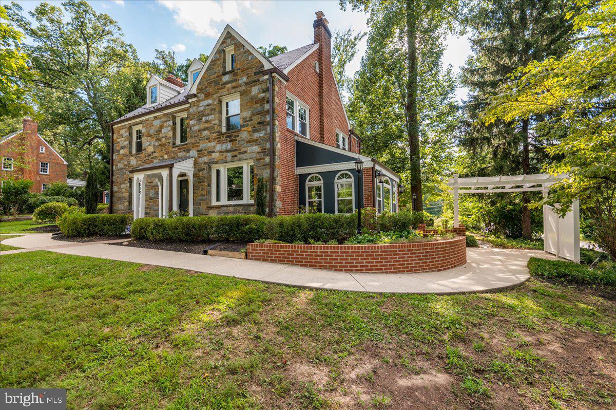 9214 Crosby Road Silver Spring, MD 20910 - Photo 2 of 65 a front view of a house with yard and green space