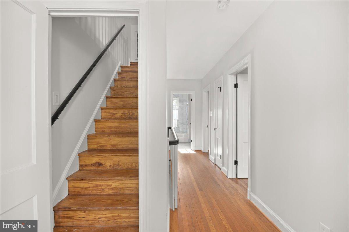 9214 Crosby Road Silver Spring, MD 20910 - Photo 39 of 65 a view of a hallway with wooden floor and entryway
