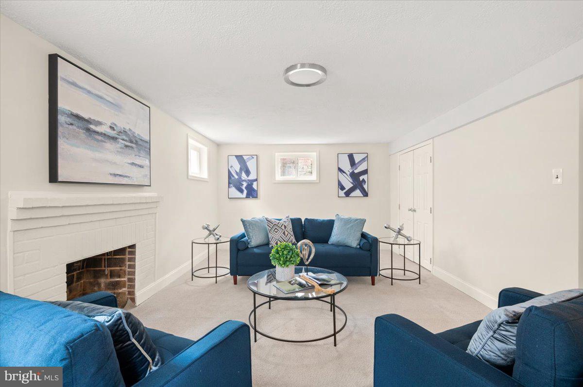 9214 Crosby Road Silver Spring, MD 20910 - Photo 45 of 65 a living room with furniture and a fireplace