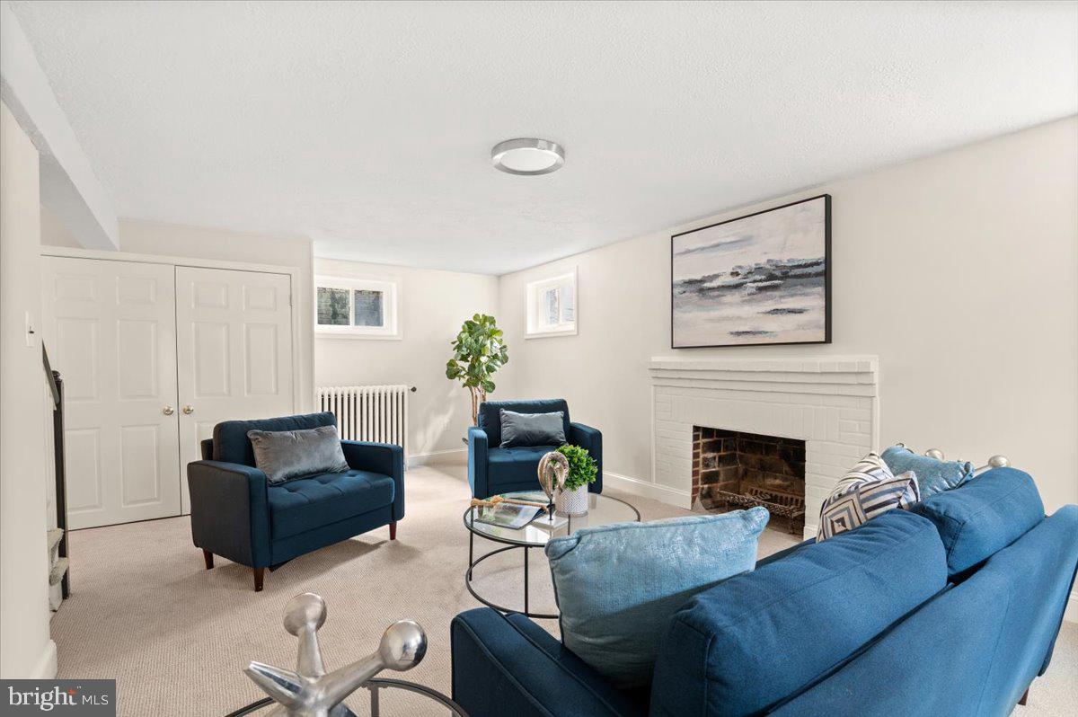9214 Crosby Road Silver Spring, MD 20910 - Photo 46 of 65 a living room with furniture and a fireplace