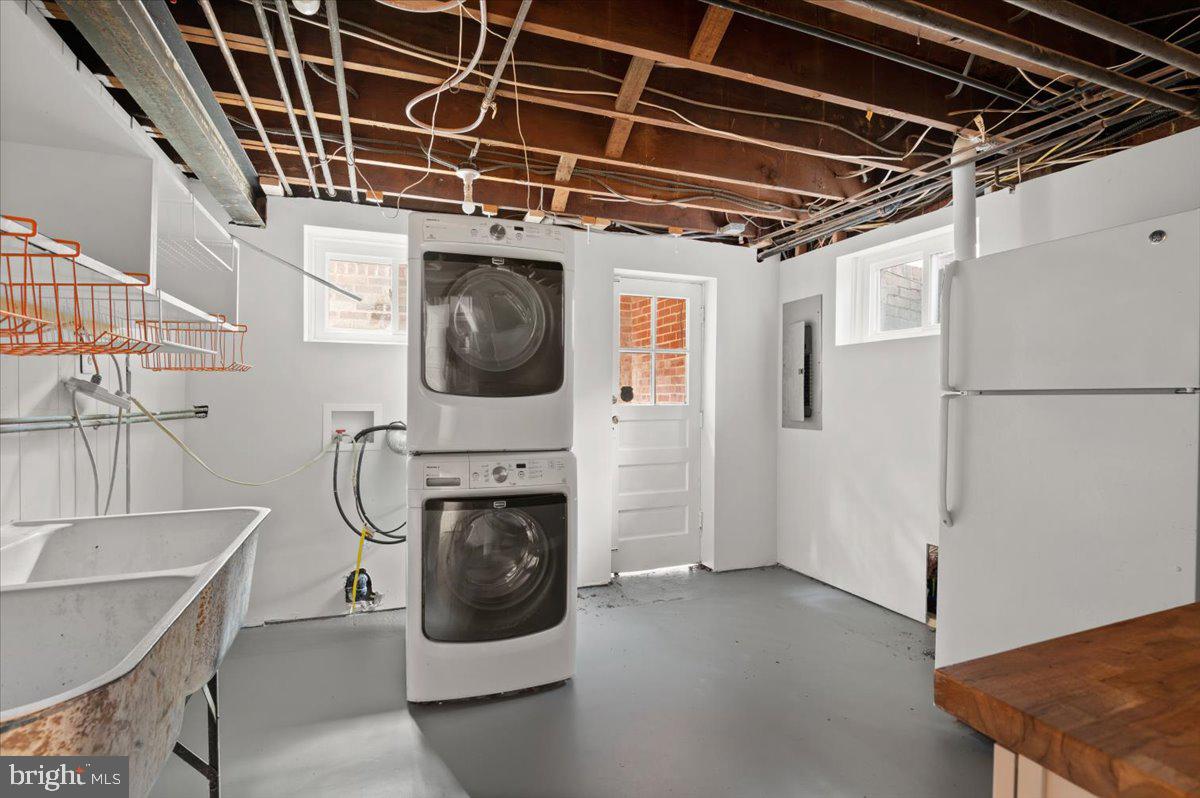 9214 Crosby Road Silver Spring, MD 20910 - Photo 50 of 65 a utility room with dryer and washer