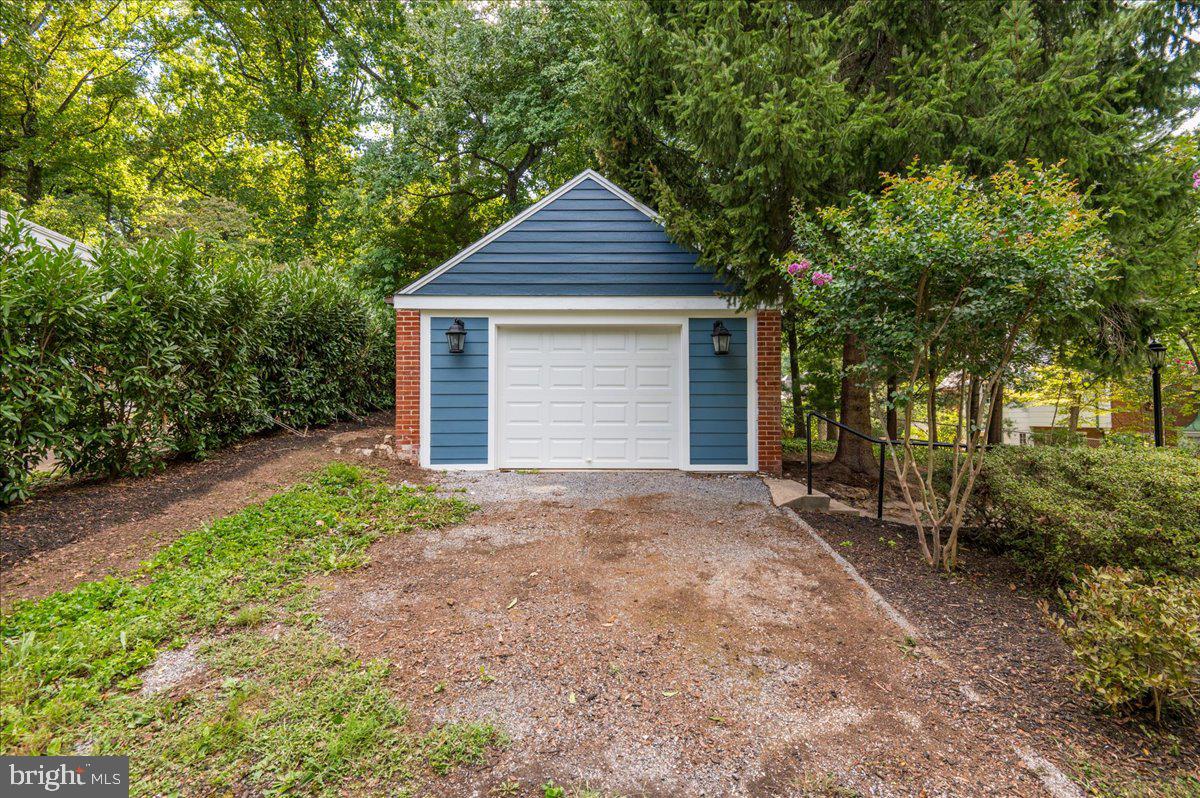 9214 Crosby Road Silver Spring, MD 20910 - Photo 51 of 65 a front view of a house with a yard and garage