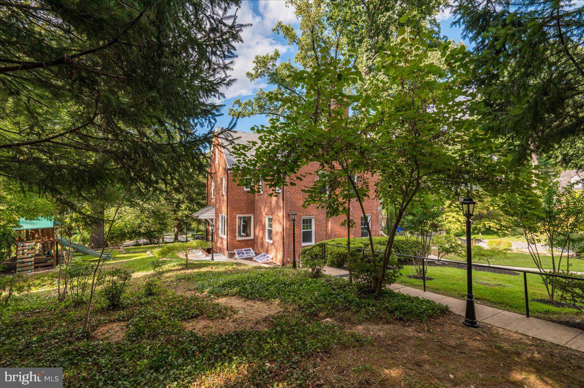 9214 Crosby Road Silver Spring, MD 20910 - Photo 54 of 65 a view of a house with a tree in the yard