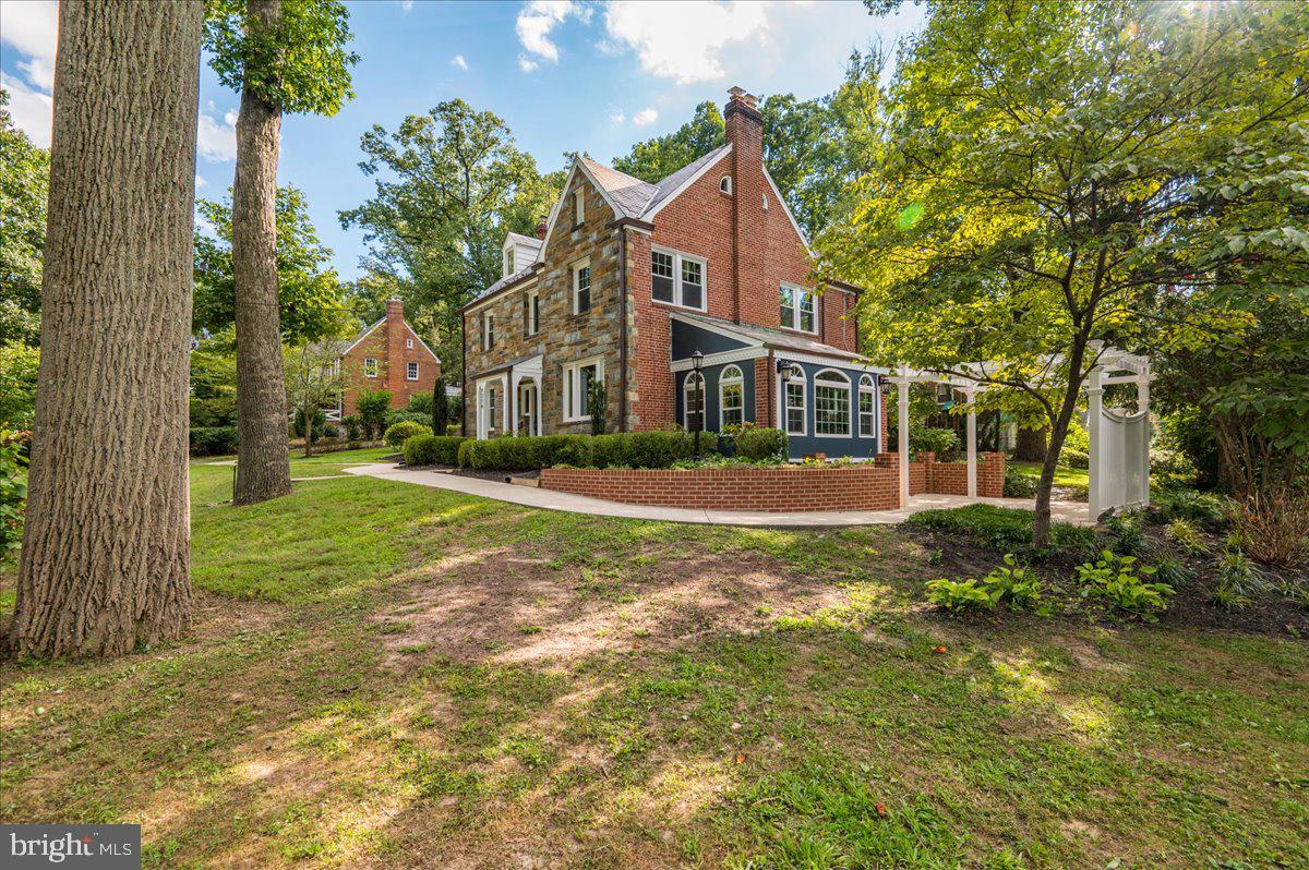 9214 Crosby Road Silver Spring, MD 20910 - Photo 6 of 65 a front view of a house with a yard