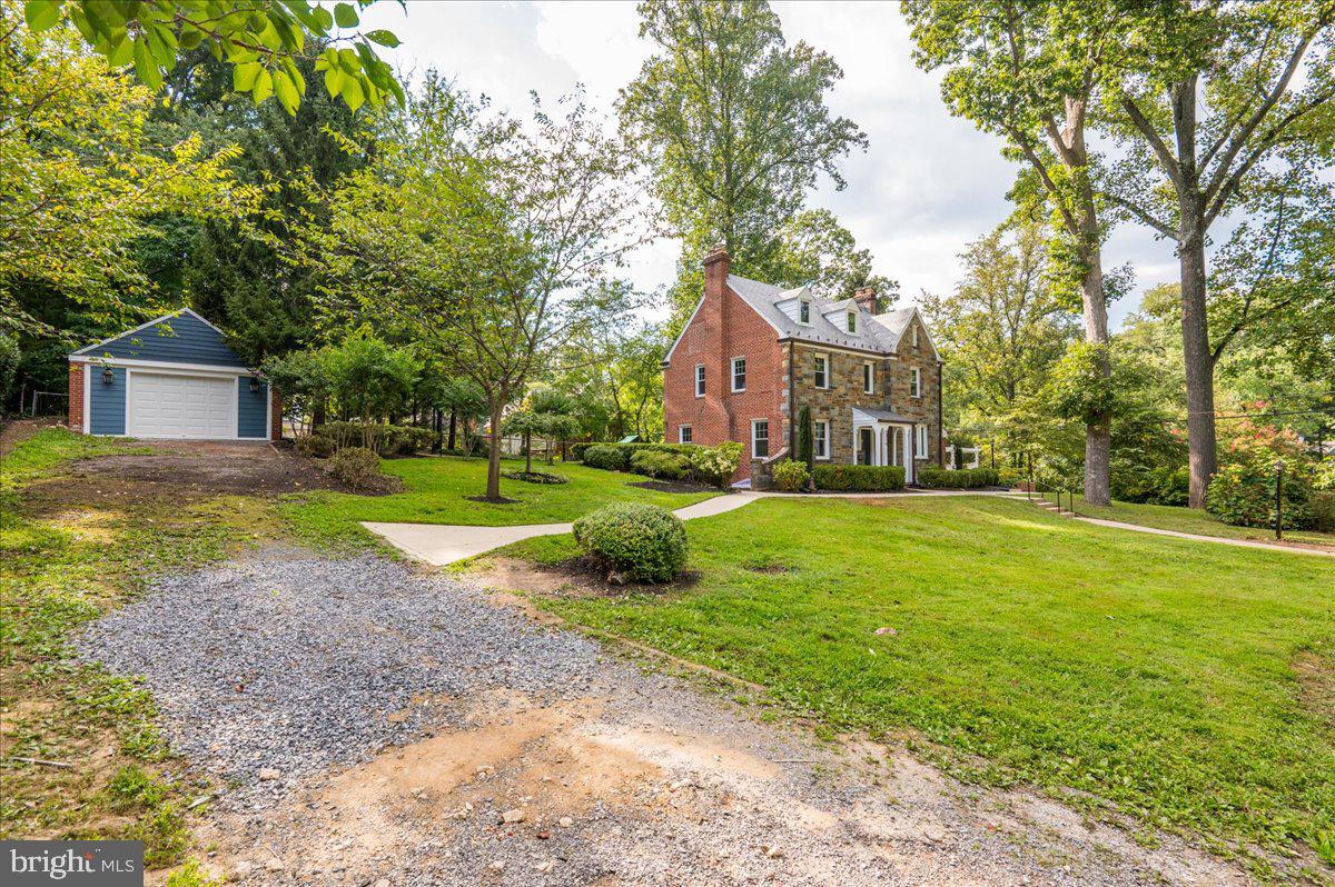 9214 Crosby Road Silver Spring, MD 20910 - Photo 7 of 65 a view of a house with a big yard and large trees