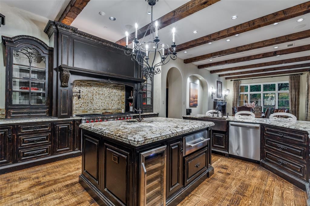 234 West Bethel Road Coppell, TX 75019 - Photo 15 of 40 a kitchen with a stove and a refrigerator