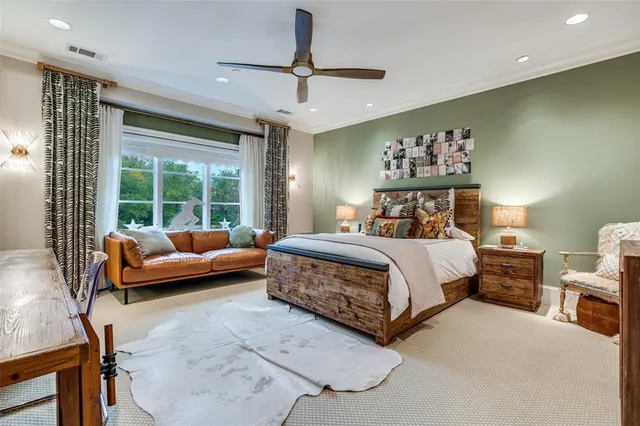a bedroom with a bed and glass window