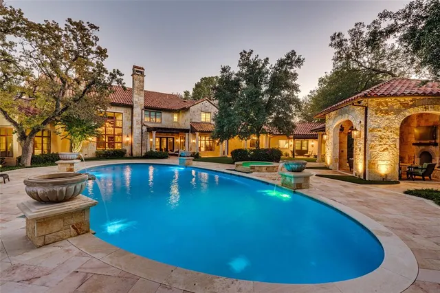 a view of a swimming pool with a lounge chairs