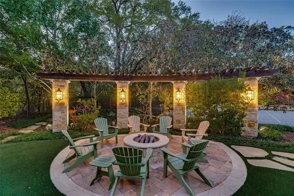 an aerial view of a house with a yard and garden