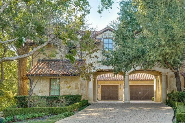 front view of a house with a garden