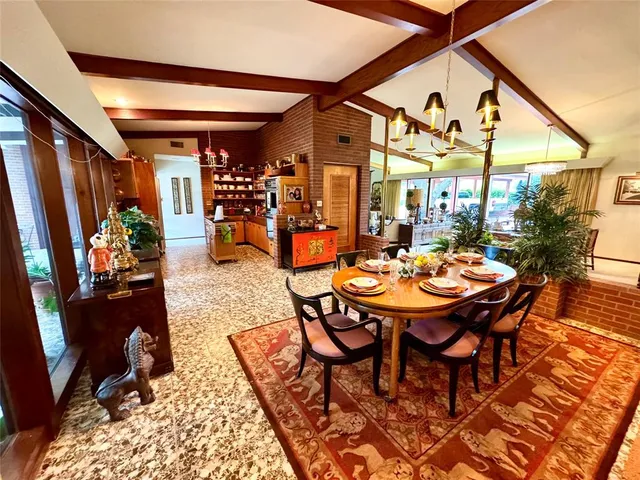 a outdoor dining space with furniture and a potted plant