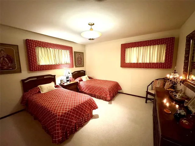 a bedroom with bed and window