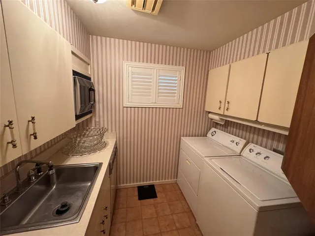 a bathroom with a sink a toilet and a tub