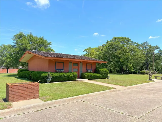 a house view with a garden space