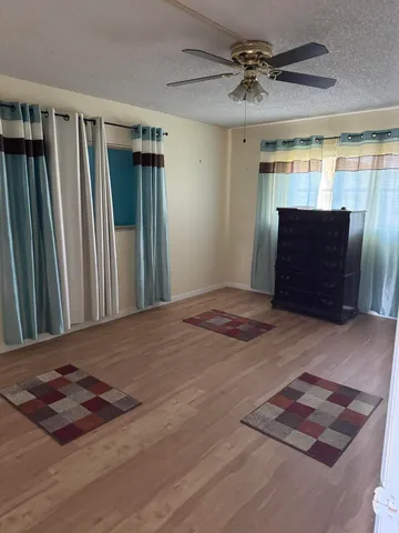 a view of entryway and hall with a fireplace