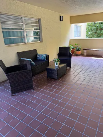 a living room with furniture and a window