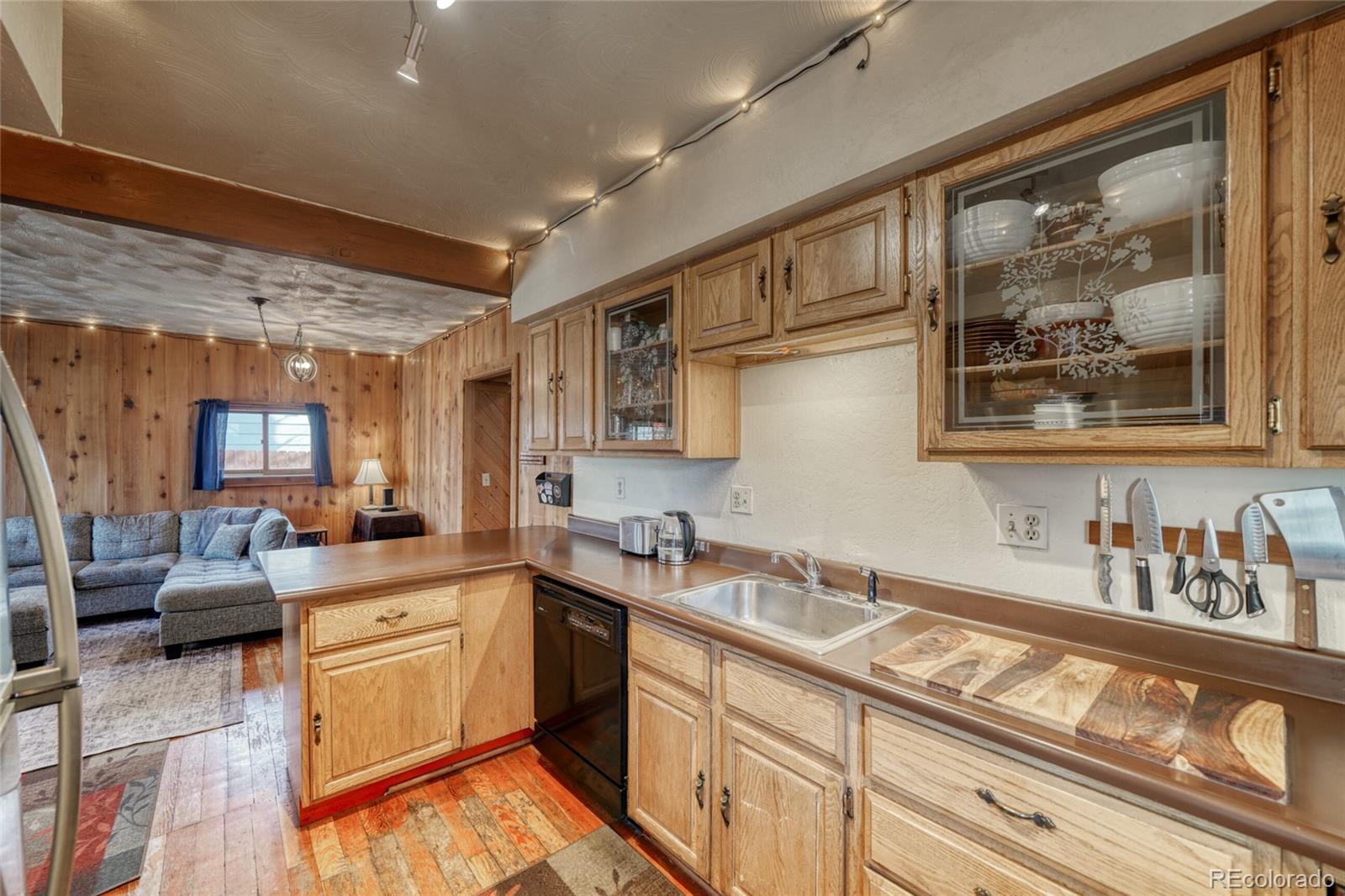 1335 F Street Salida, CO 81201 - Photo 13 of 44 a kitchen with stainless steel appliances granite countertop a sink stove and cabinets