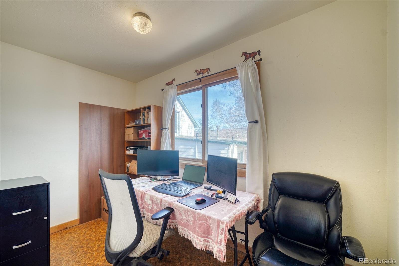 1335 F Street Salida, CO 81201 - Photo 19 of 44 a workspace with furniture and window