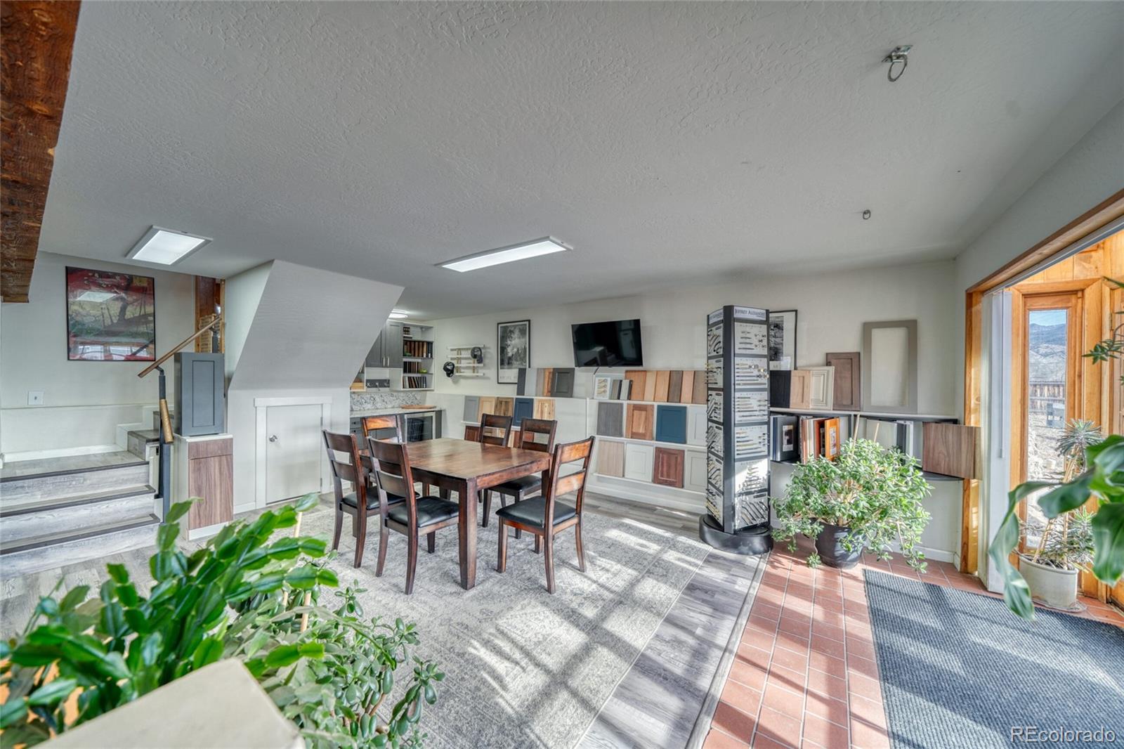 1335 F Street Salida, CO 81201 - Photo 31 of 44 a view of a dining room with furniture and a potted plant
