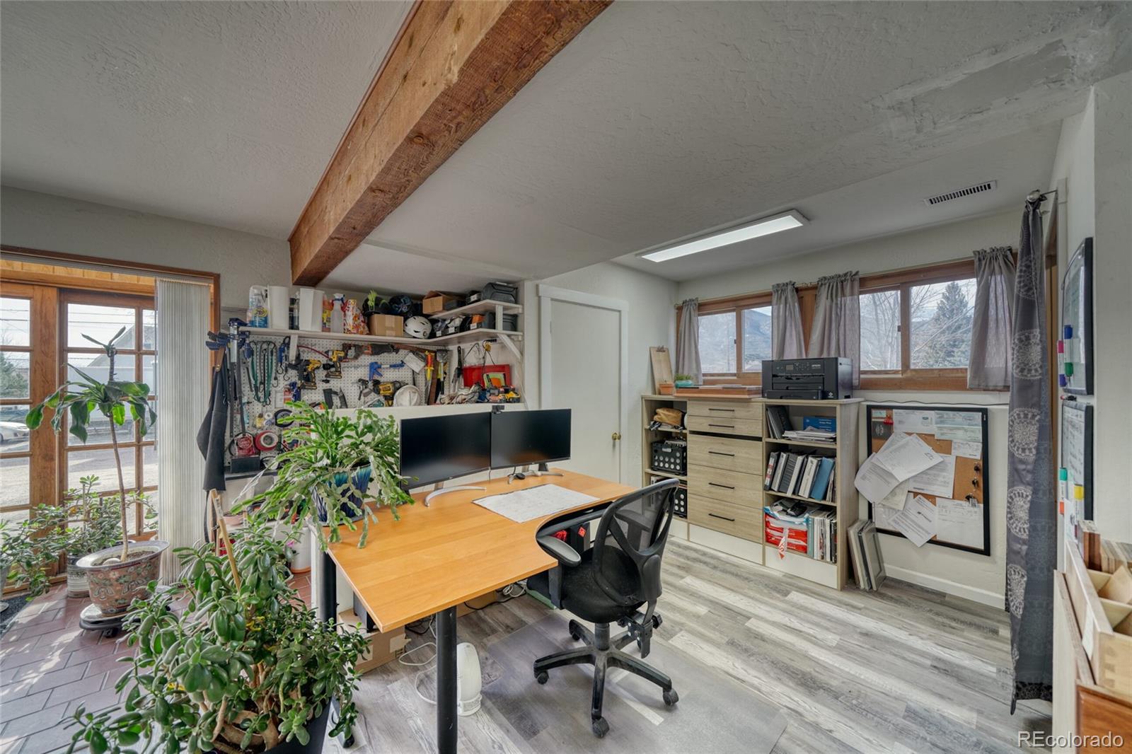 1335 F Street Salida, CO 81201 - Photo 35 of 44 a view of a workspace with furniture and a potted plant