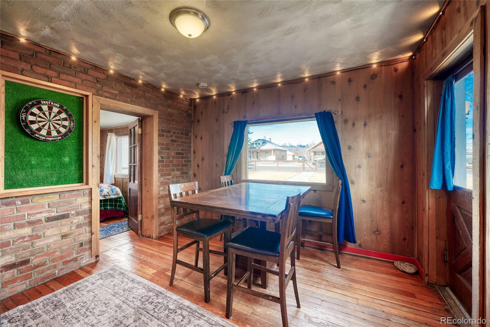 1335 F Street Salida, CO 81201 - Photo 5 of 44 a view of a dining room with furniture and a window