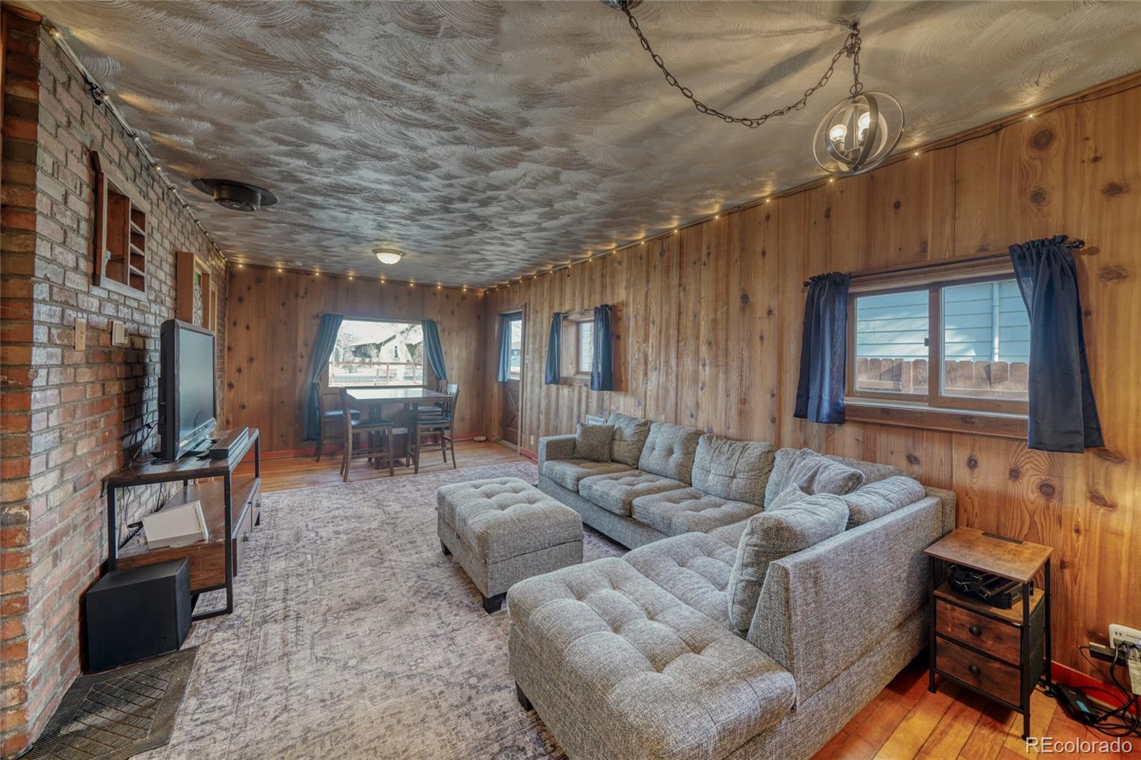 1335 F Street Salida, CO 81201 - Photo 9 of 44 a living room with furniture and a flat screen tv