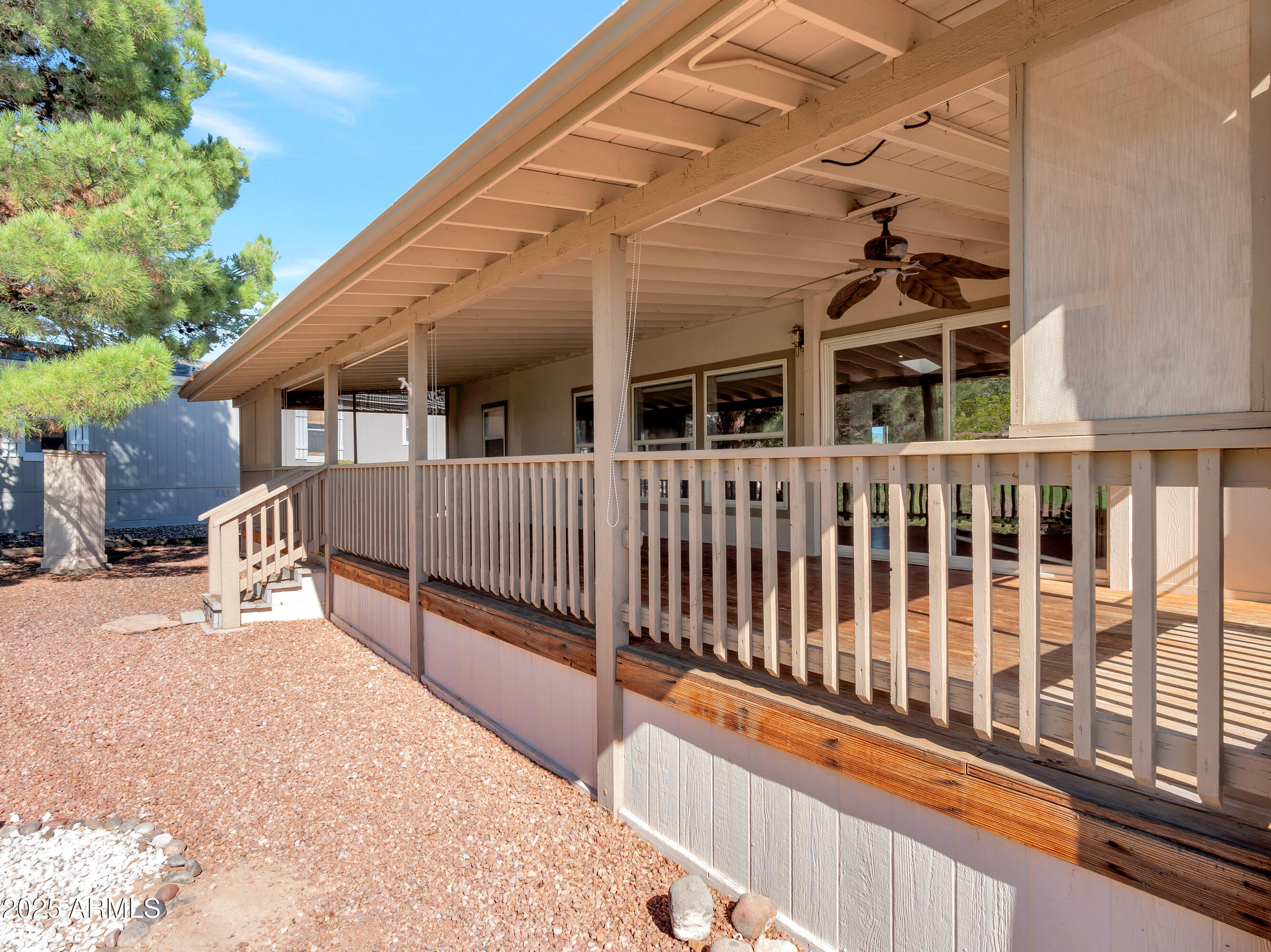 2050 West State Rte 89A, Unit 344 Sedona, AZ 86336 - Photo 31 of 35 a view of a house with a wooden deck